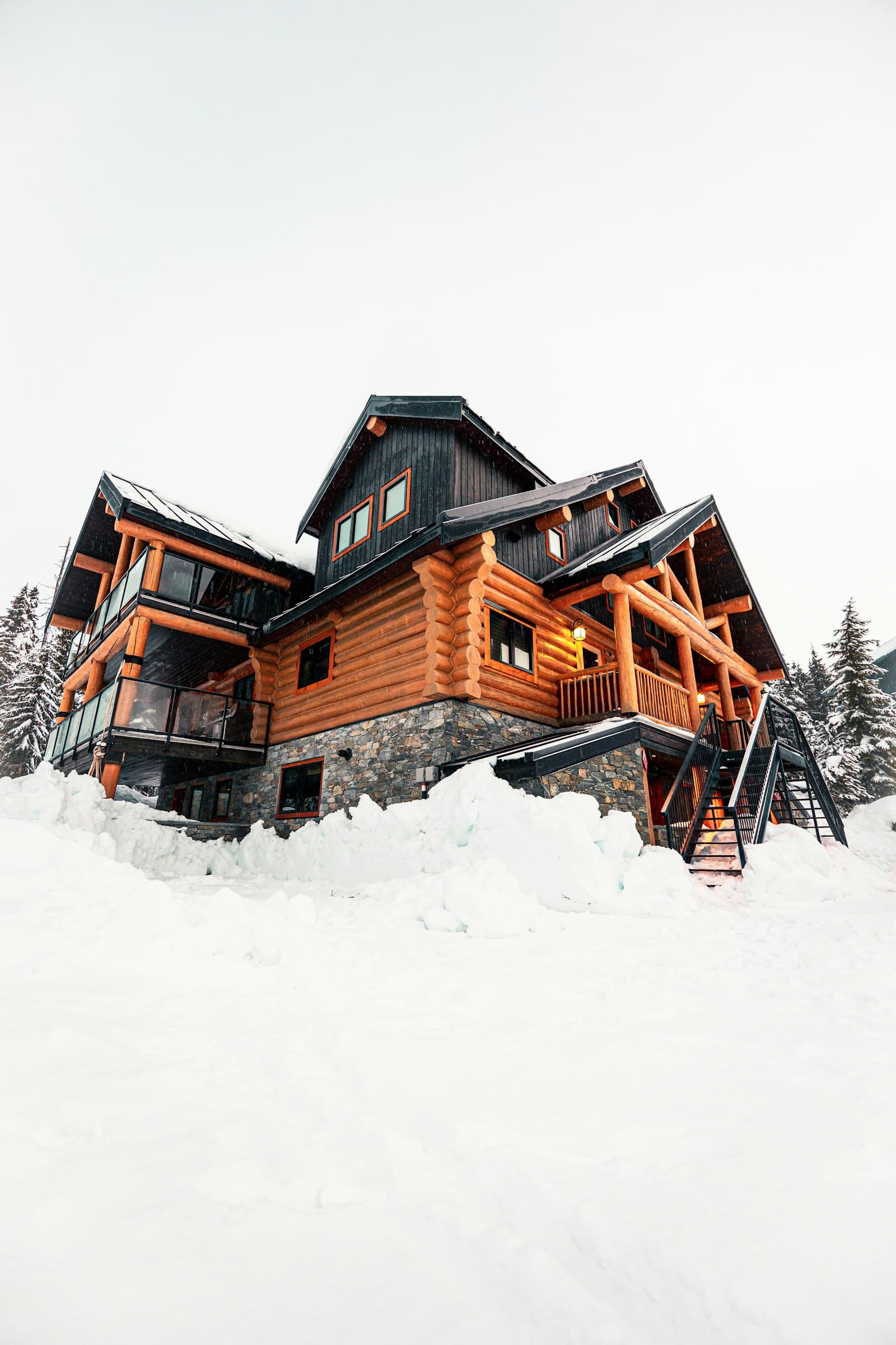 Luxury timber-and-stone ski lodge surrounded by deep snow
