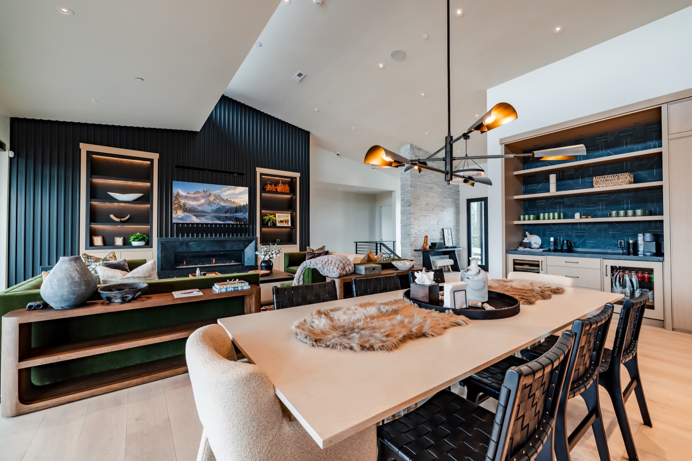 Dining area beside a fireplace in a contemporary Park City home
