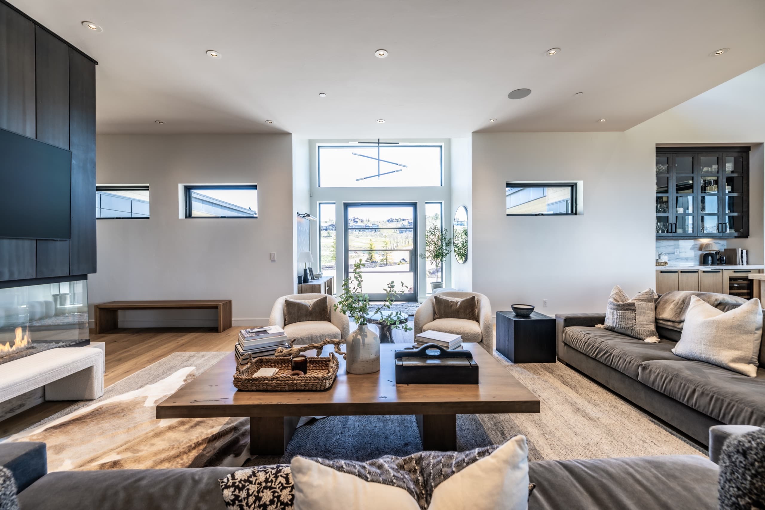 Warm living room with a fireplace in a luxury Park City home