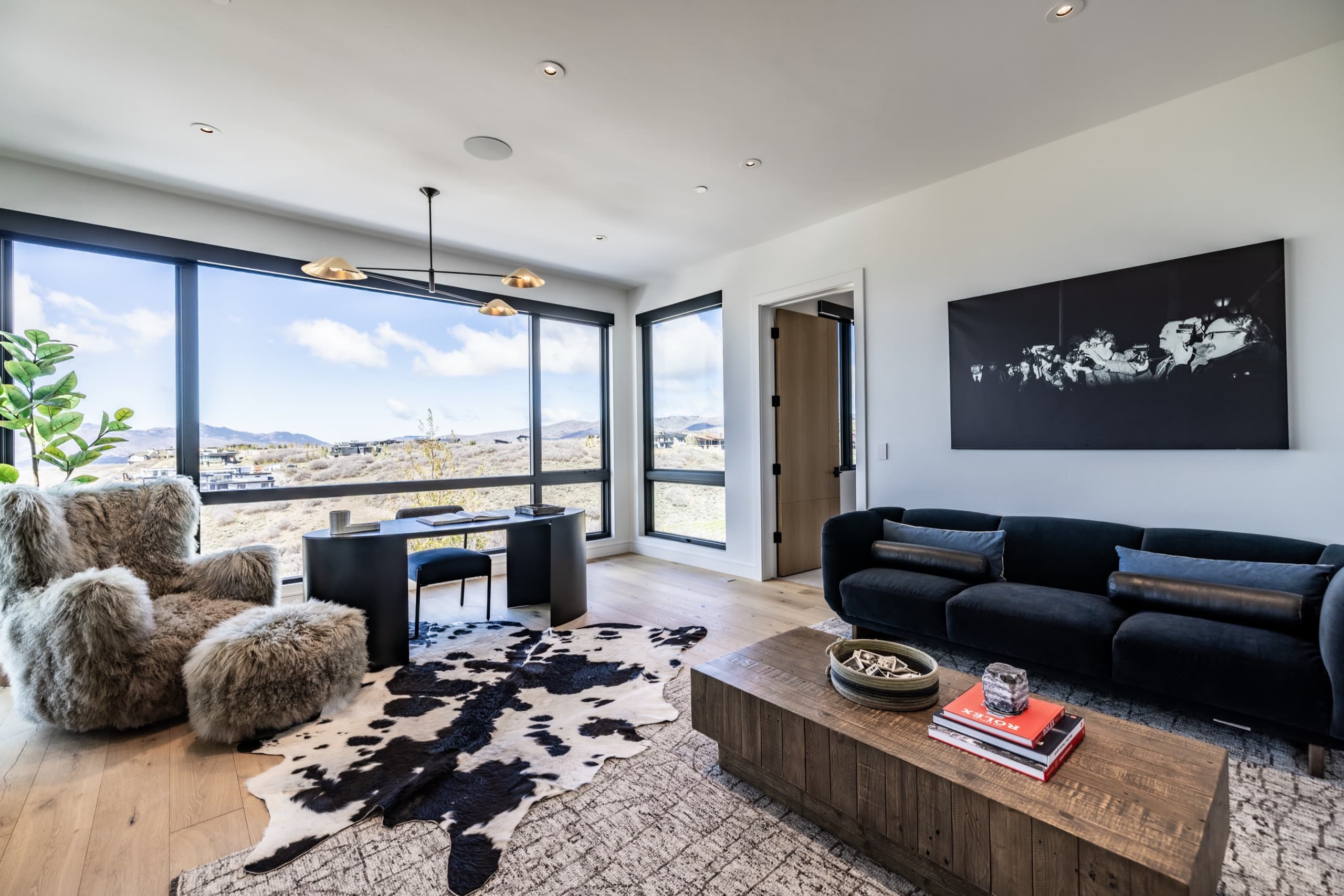 Dining area with floor to ceiling mountain views in a luxury Park City home