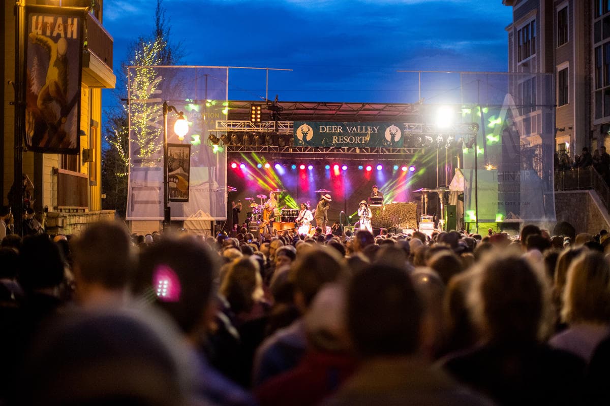 Evening outdoor concert and crowd at a Park City resort plaza