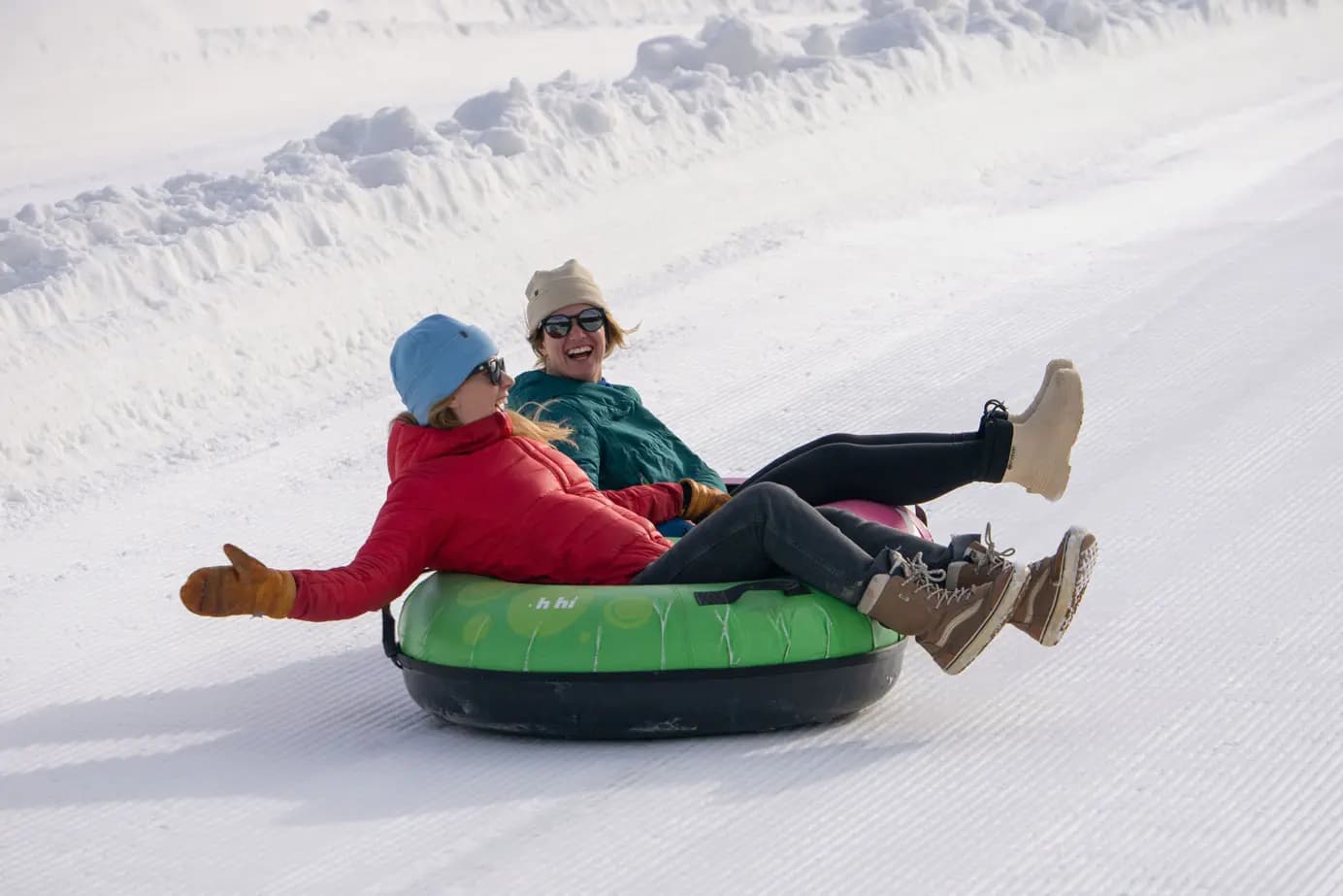 Families tubing down groomed lanes