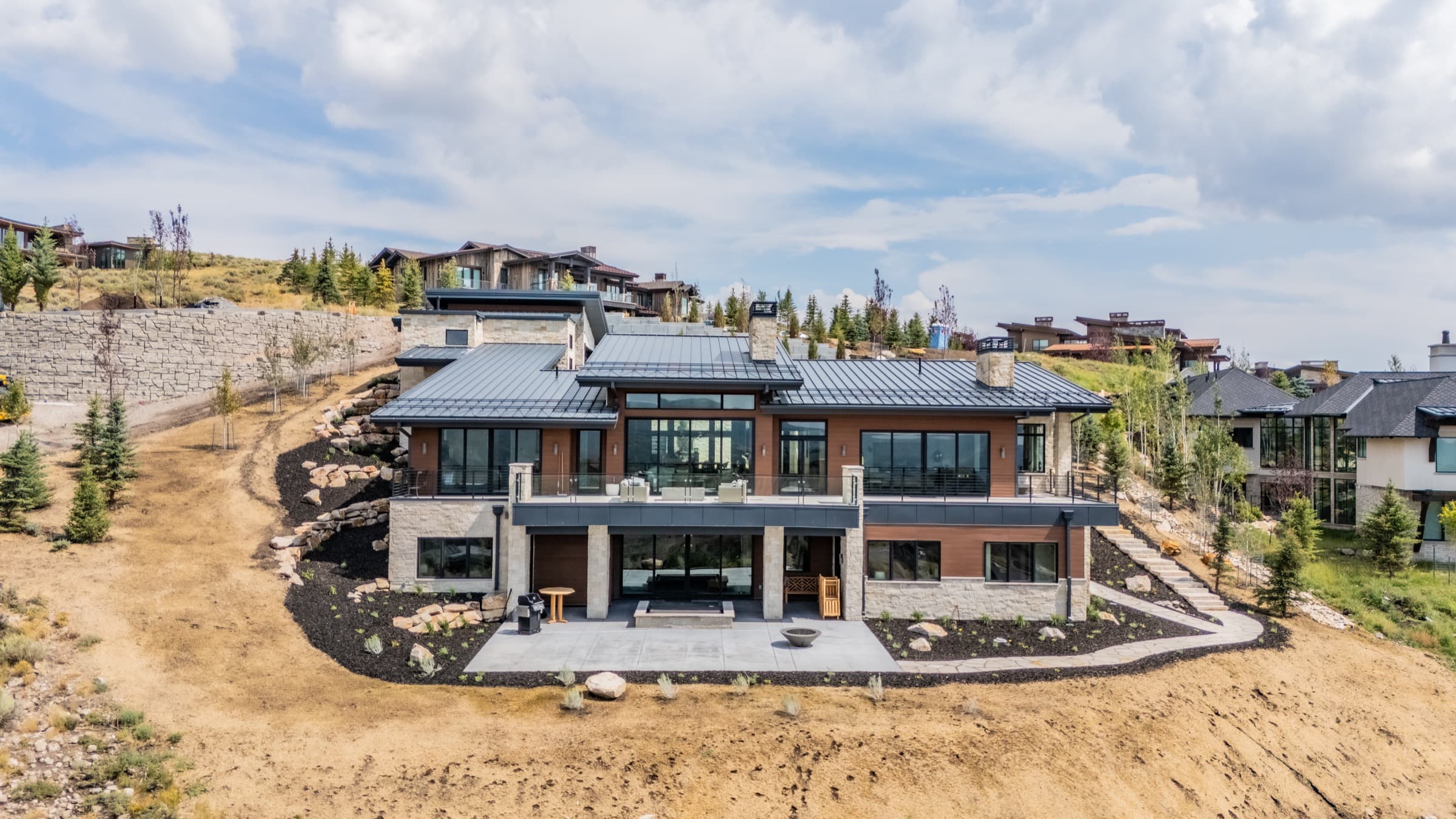 Aerial view of a modern Park City luxury home set into a hillside